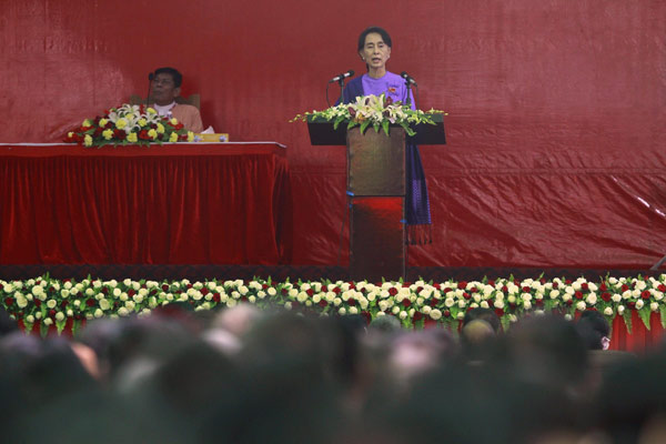 Myanmar's pro-democracy leader Aung San Suu Kyi delivers her speech at the National League for Democracy party's (NLD) congress in Yangon March 10, 2013.  Aung San Suu Kyi re-elected opposition leader